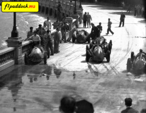 1950 год. Хуан-Мануэль Фанхио на болиде под номером 34 объезжает место массовой аварии, случившейся в конце первого круга Гран-При Монако